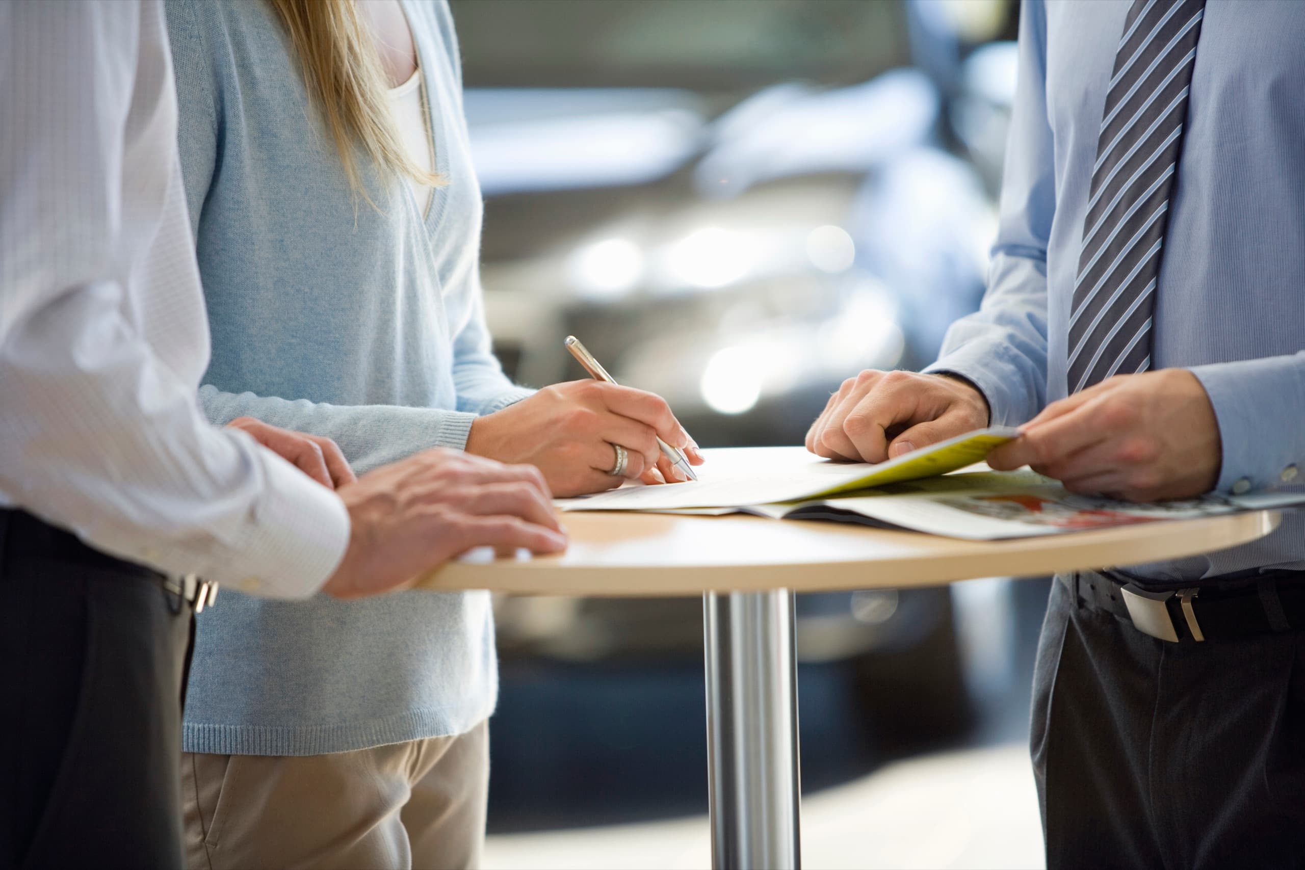Woman signing a property contract