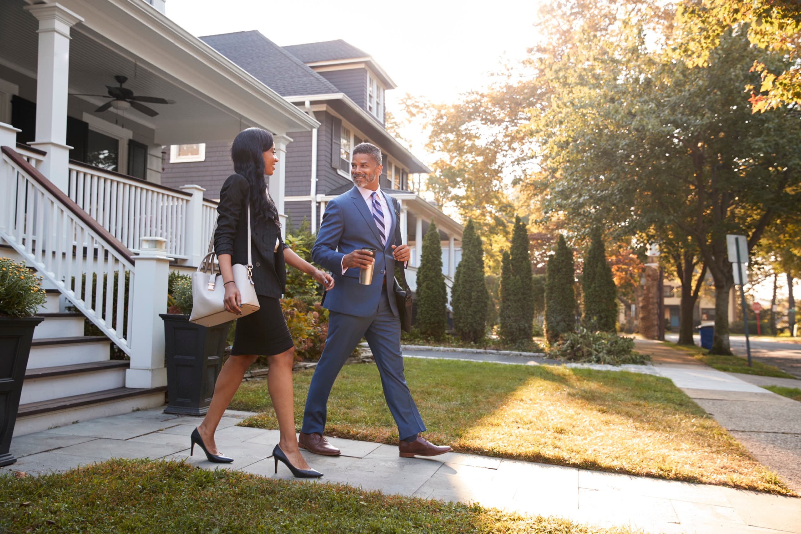 Couple commuting from suburban home
