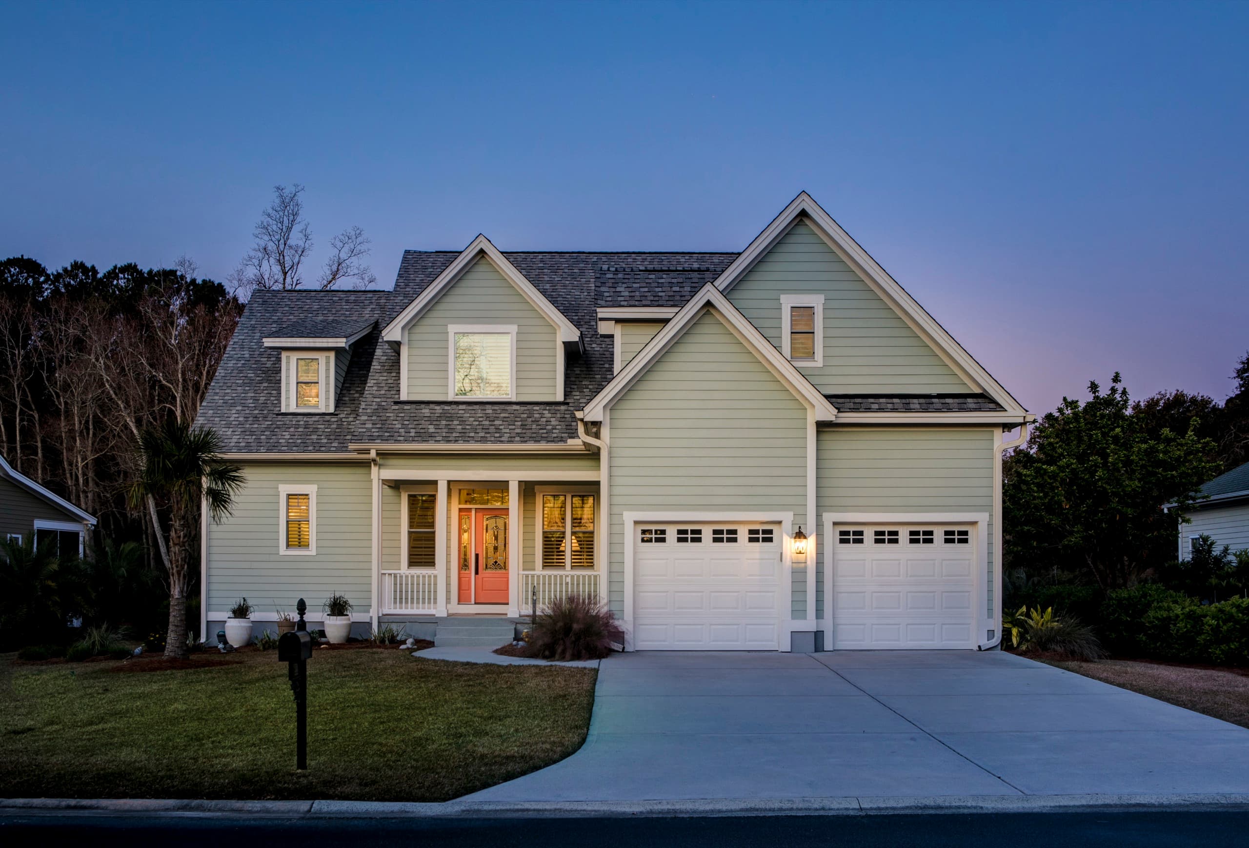 Beautiful home lit up at twilight managed by DFW Property Management