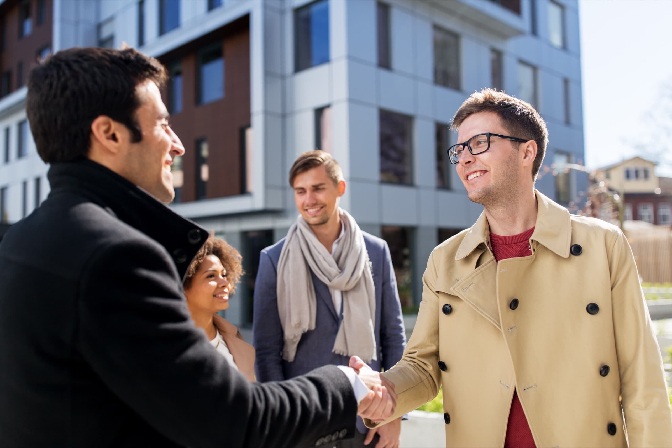 DFW Property Management team shaking hands with a client